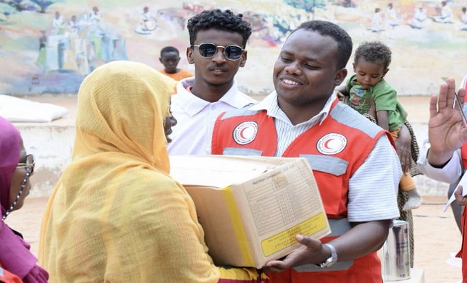People in Sudan receiving charitable commodities. Jun. 8, 2023.