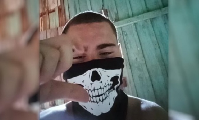 The attacker wearing the mask he used in the school shooting in Cambe, Brazil, June 2023.