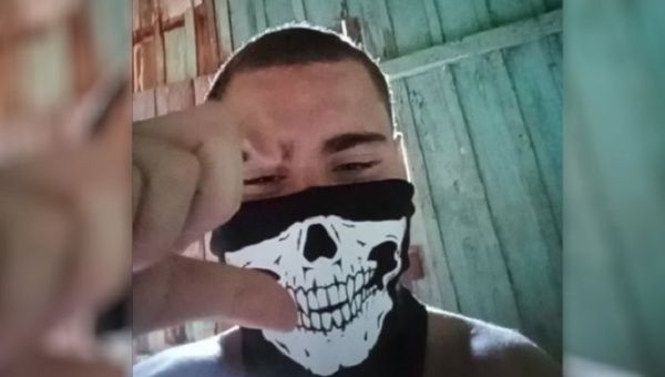 The attacker wearing the mask he used in the school shooting in Cambe, Brazil, June 2023.
