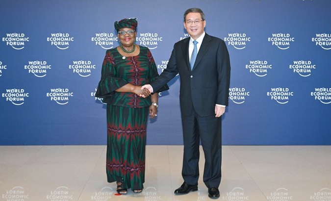 WTO Director Ngozi Okonjo-Iweala (L) & Chinese Premier Li Qiang (R), June 26, 2023.