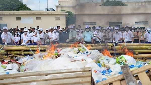 Drugs burning down at ceremony in Cambodia. Jun. 28, 2023.