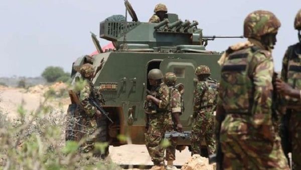 Kenyan soldiers patrol a border area, July 2023.