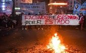 The sign reads, "Facundo was assassinated by the State."
