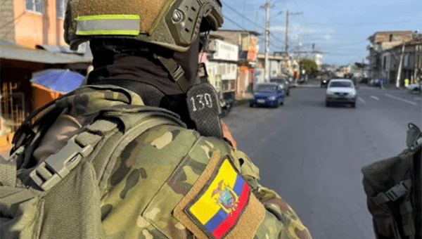Soldiers patrol the streets of an Ecuadorian city, Aug. 2023.