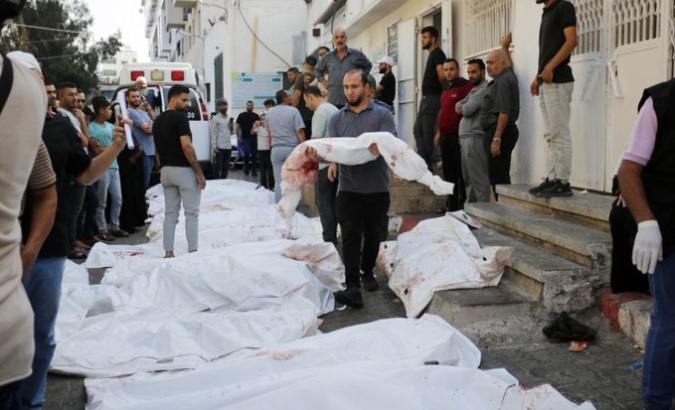 Bodies piled up outside a hospital in Gaza, OC. 11, 2023.
