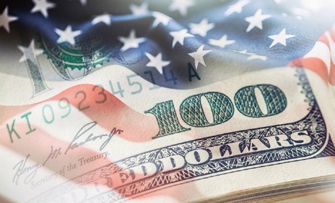 U.S. flag superimposed on dollar bills.