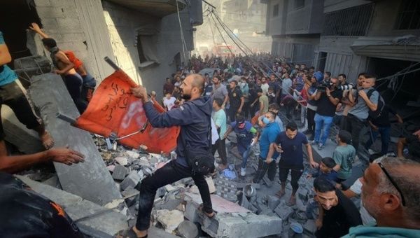 Rescuers try to save victims of the Israeli bombing in Gaza, Oct. 25, 2023.
