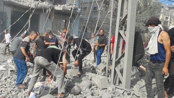 People rescue victims of the Israeli bombing in Gaza, Nov. 6, 2023.