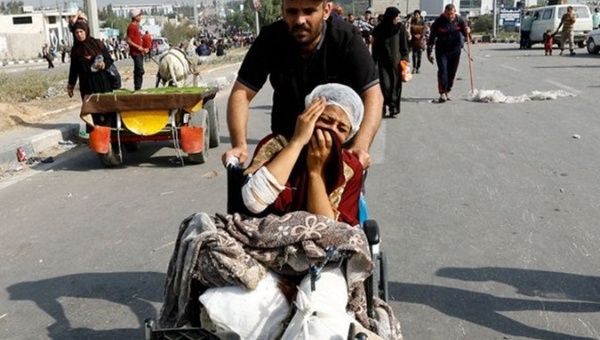 Palestinians head towards southern Gaza after Israeli bombing of hospitals, Nov. 10, 2023.
