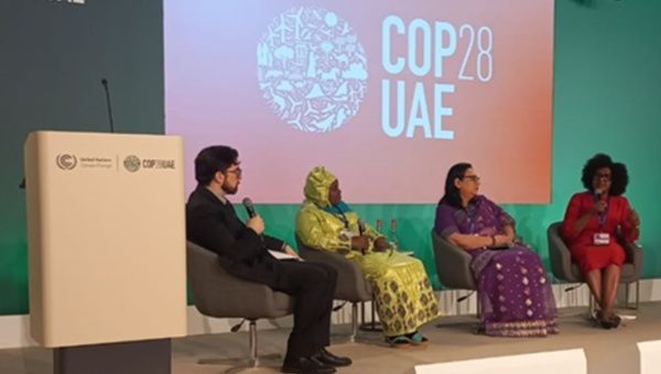 People at a meeting on climate finance strategies, Dubai, UAE, Dec. 5, 2023.