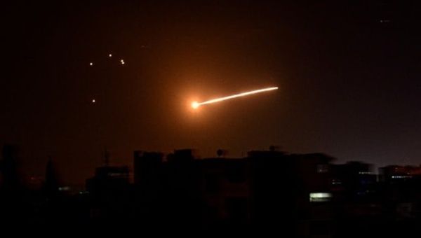 A missile crossing the sky over Damascus, Dec. 28, 2023.