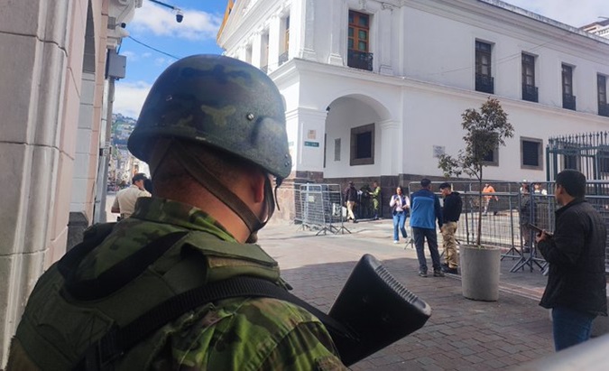 Military guard the exterior of the Ecuadorian government headquarters in Quito, Jan. 10, 2024.