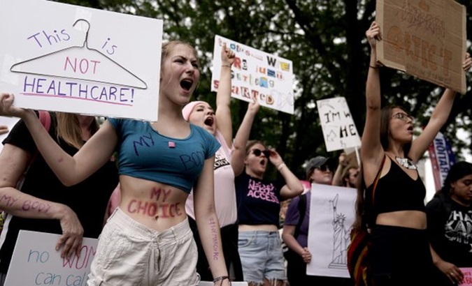 People at a rally demanding safe and legal abortion.