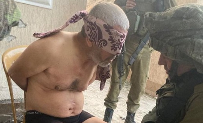 Elderly Palestinian Hussein al-Masri is interrogated by Israeli forces after arbitrarily arresting him, Feb. 19, 2024.