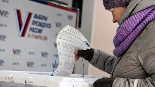 A Russian woman casts her vote, March 15, 2024.