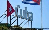 A Cuban flag flies near the beach.