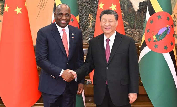 PM Roosevelt Skerrit (L) and Chinese President Xi Jinping (R), March 25, 2024.