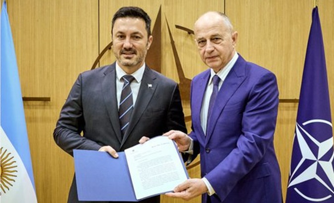 Defense Minister Luis Petri (L) & NATO Deputy Secretary Mircea Geoana (R).