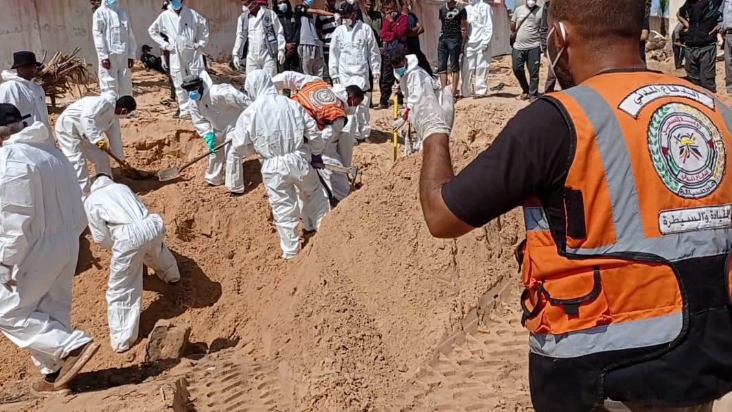 The Mass Grave. Palestinian authorities recover the bodies.