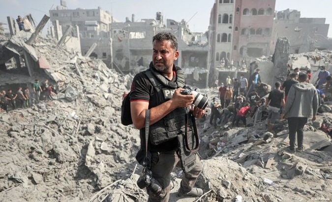 A Palestinian journalist in Gaza, 2024.