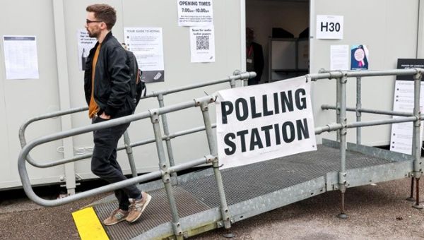 A voter leaves a polling station in London, Britain, May 2, 2024. 