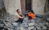 Father and their daughters in the ruins of Gaza, May 2024