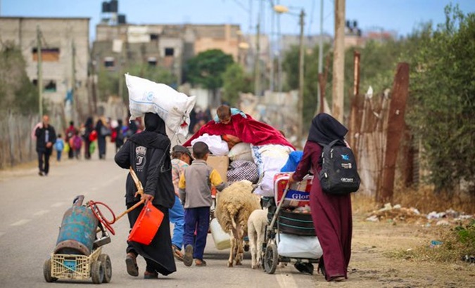 Palestinians move outside Rafah in Gaza, May 6, 2024.