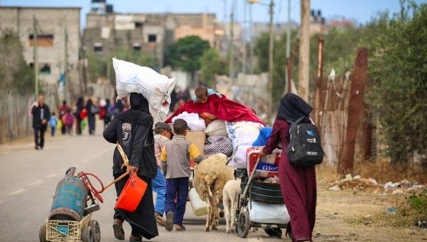 Palestinians move outside Rafah in Gaza, May 6, 2024.