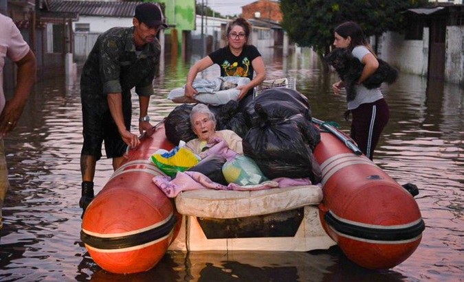 Elderly woman rescued from the flood in Rio Grande do Sul, Brazil, May, 2024.