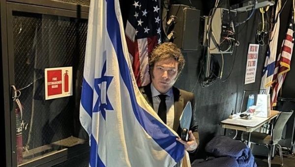 Argentine President Javier Milei posing with the flags of Israel and the U.S., May 6, 2024.