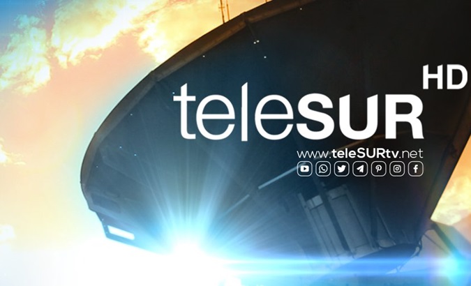 Poster with one of the teleSUR satellite antennas.
