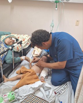 Doctor attending to a little child in Gaza, May 2024