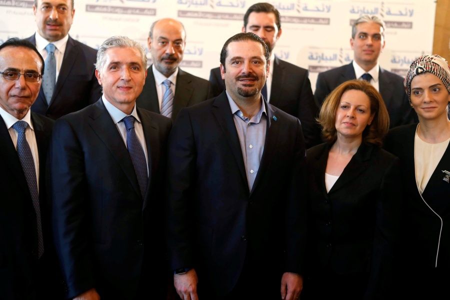 Lebanon's former Prime Minister Saad al-Hariri (C) poses with the Future Movement candidates after announcing their list of candidates for the municipality elections in Beirut, Lebanon, April 26, 2016. | PHOTO: Reuters