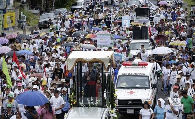 Pilgrims march to a Mass in Romero's honor in El Salvador